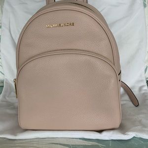 Michael Kors Abbey Medium Pebbled Leather Backpack.